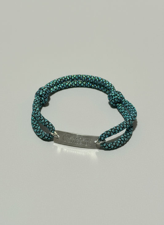Blue rope bracelet with a metal tag "Clean Heart Campaign"