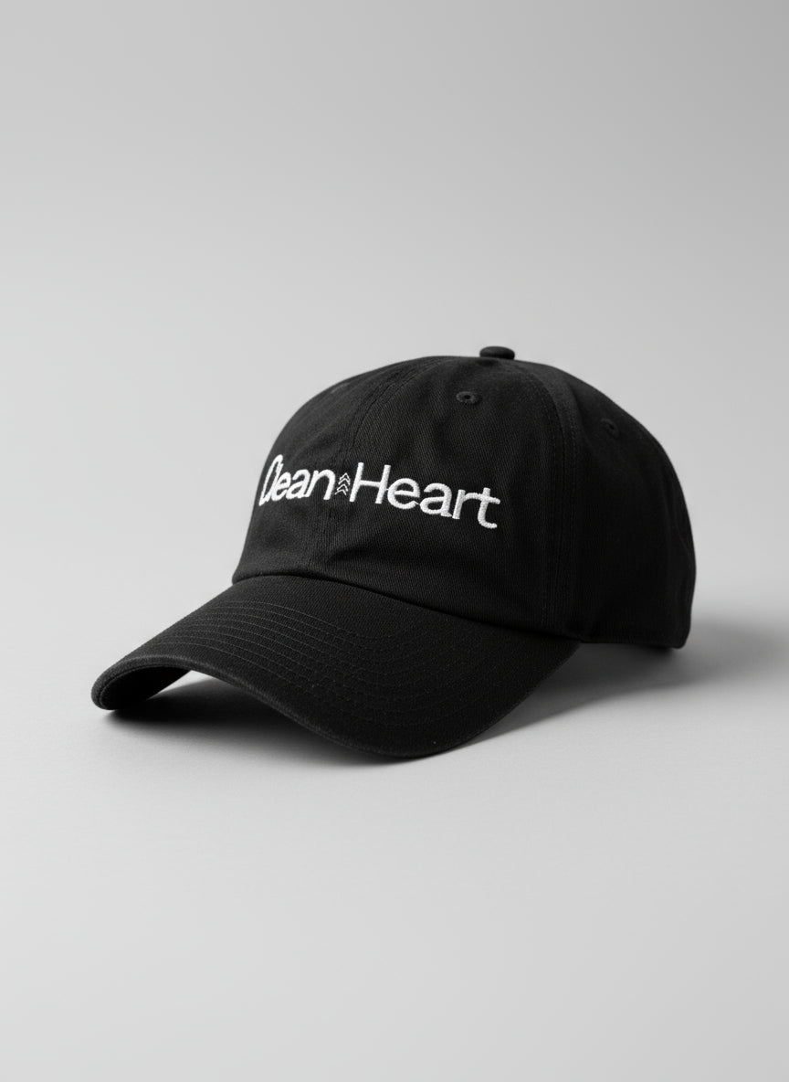 Black cap with 'Clean Heart' text on a textured surface