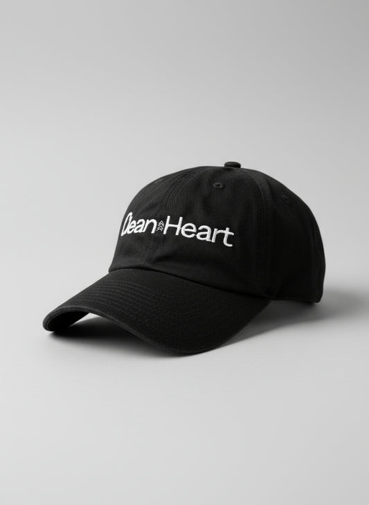 Black cap with 'Clean Heart' text on a textured surface