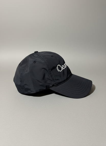Black nylon cap with white logo "Clean Heart" embroidered on it