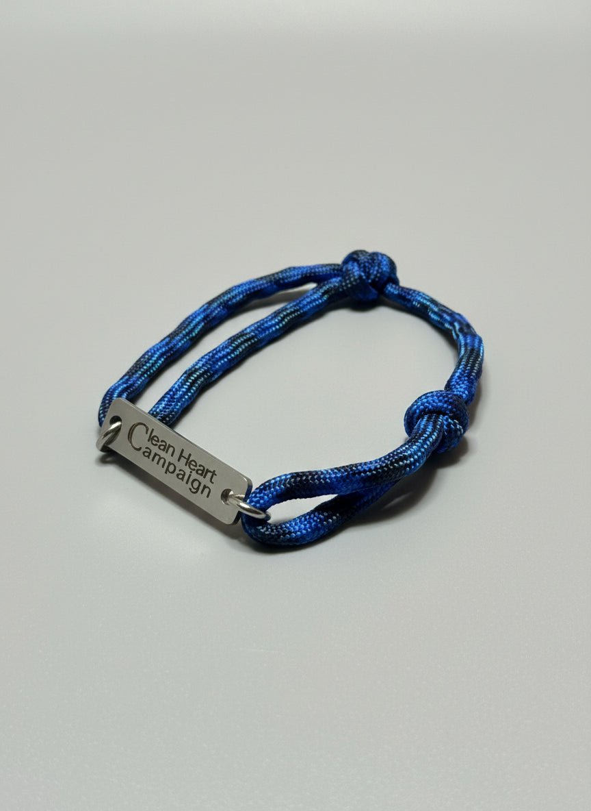 Blue braided bracelet with a metal tag