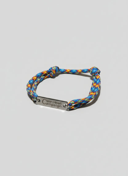 Multicolored braided bracelet with silver tag "Clean Heart Campaign"