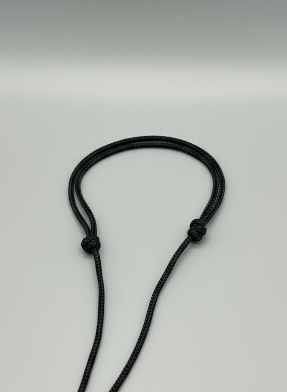 Black cord necklace with knotted adjustment closure