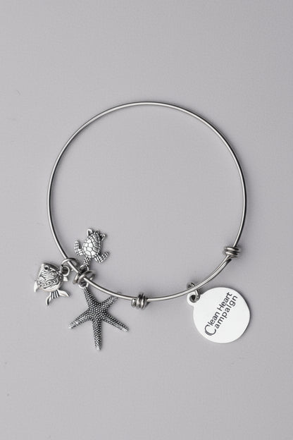 Silver bracelet with starfish and fish charms 