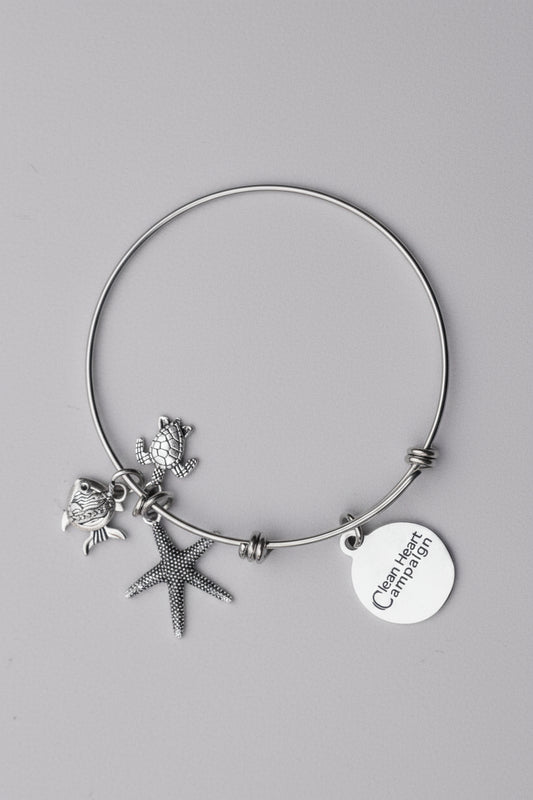 Silver bracelet with starfish and fish charms 