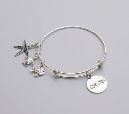 Silver bracelet with turtle and starfish charms 