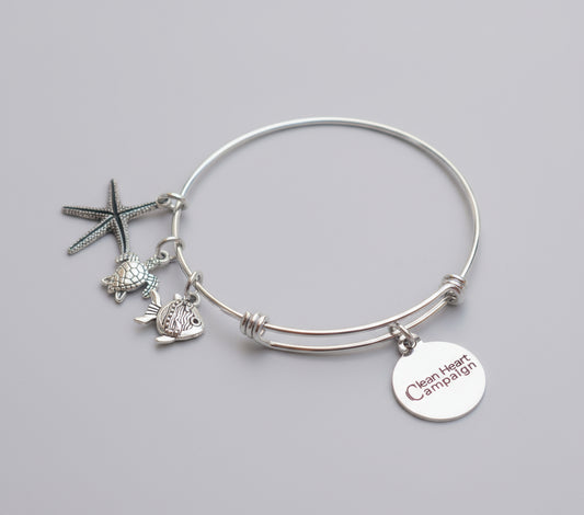 Silver bracelet with turtle and starfish charms 